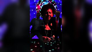 Elon and Trump dancing while Glendale Staljer Bitch gazes